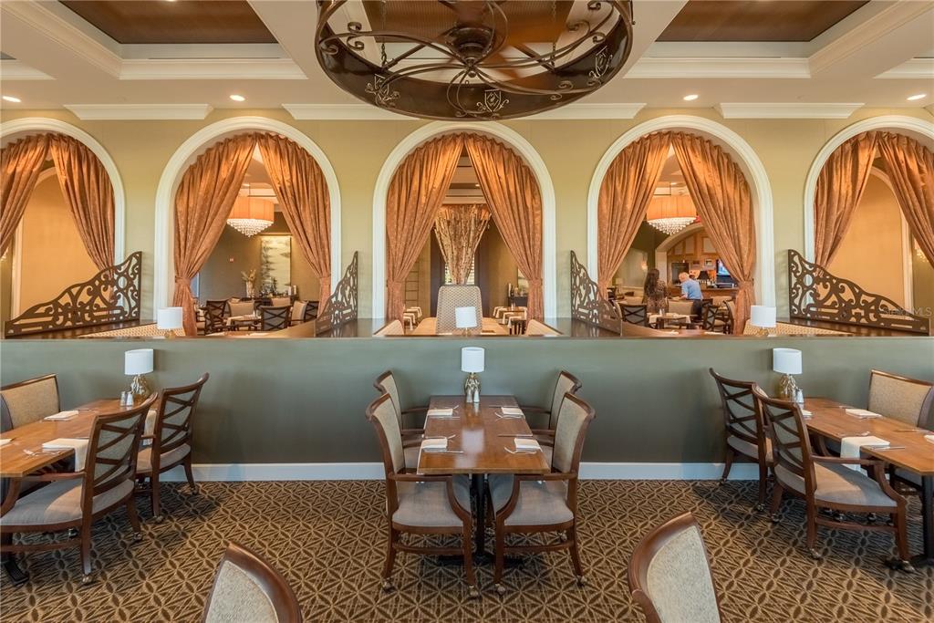 6919 Dominion Lane Lakewood Ranch, FL 34202 - Photo 91 of 99 a front view of a house with outdoor seating