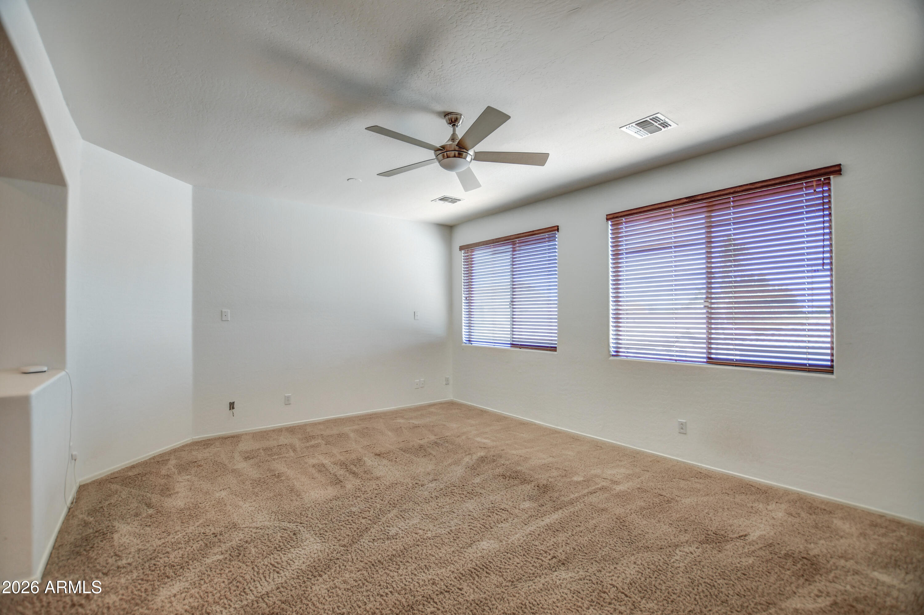 3078 East Muirfield Street Gilbert, AZ 85298 - Photo 57 of 92 a view of a room with windows and ceiling fan