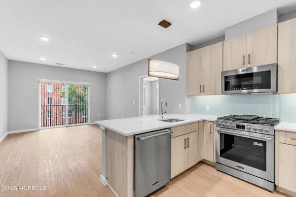 a kitchen with a stove and a sink