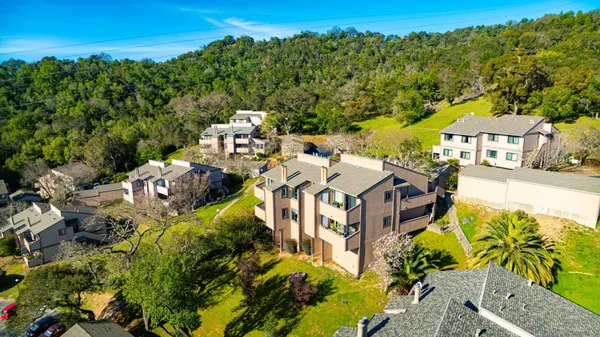 aerial view of a house with a yard