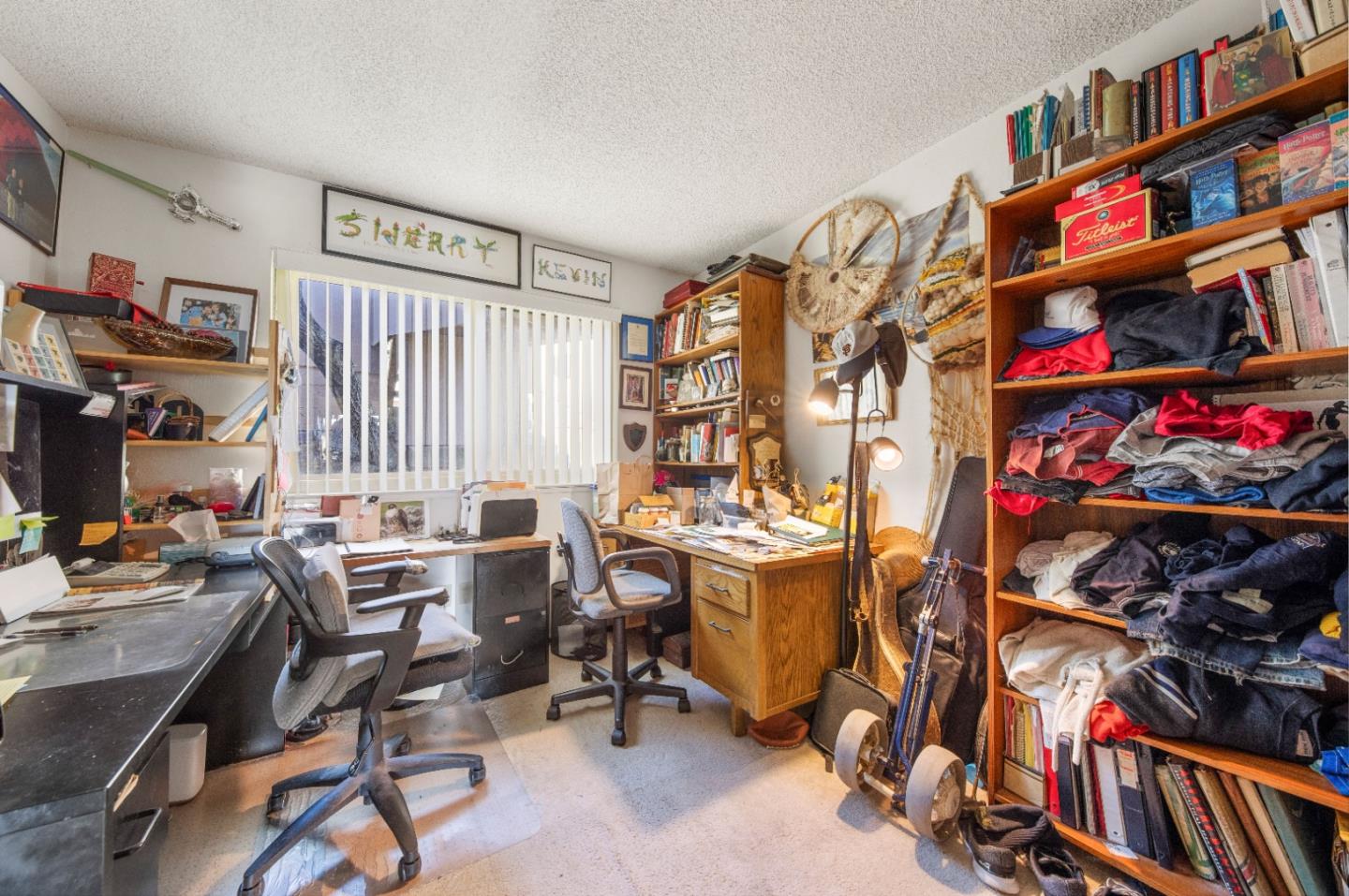 46 Grass Court Novato, CA 94949 - Photo 10 of 21 a view of a workspace with furniture and a bookshelf