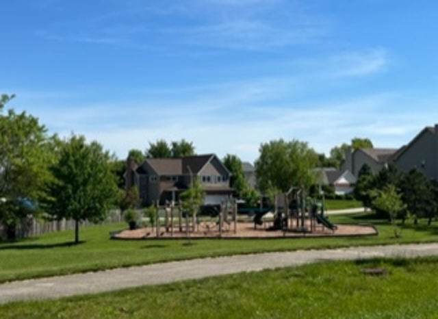 59 Casey Drive Minooka, IL 60447 - Photo 2 of 3 a childrens park with lots of trees and plants