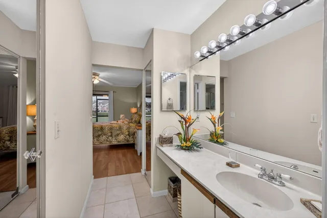 a view of a livingroom with furniture and a potted plant