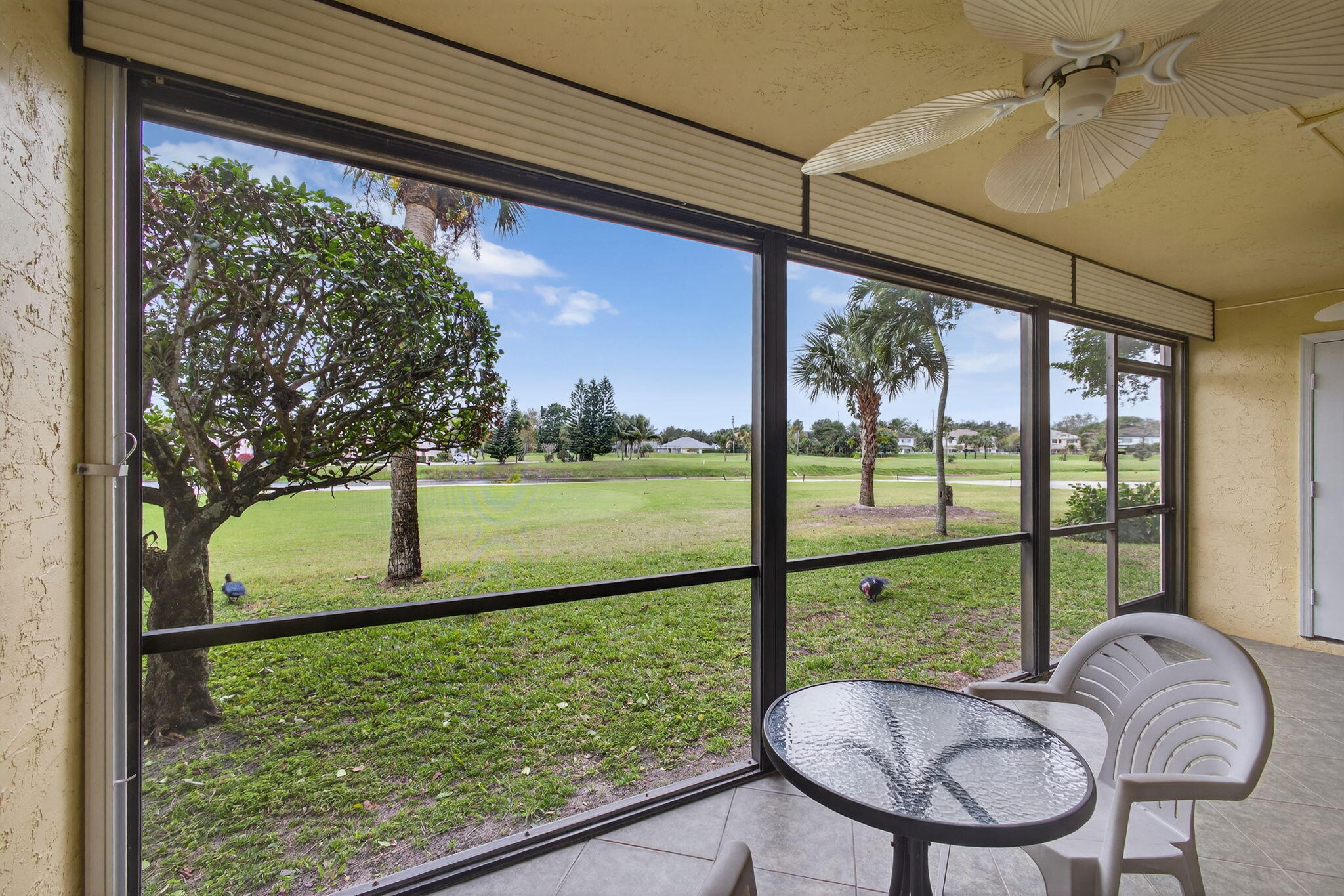 2041 Keystone Drive, Unit F Jupiter, FL 33458 - Photo 36 of 63 a view of a porch and a backyard