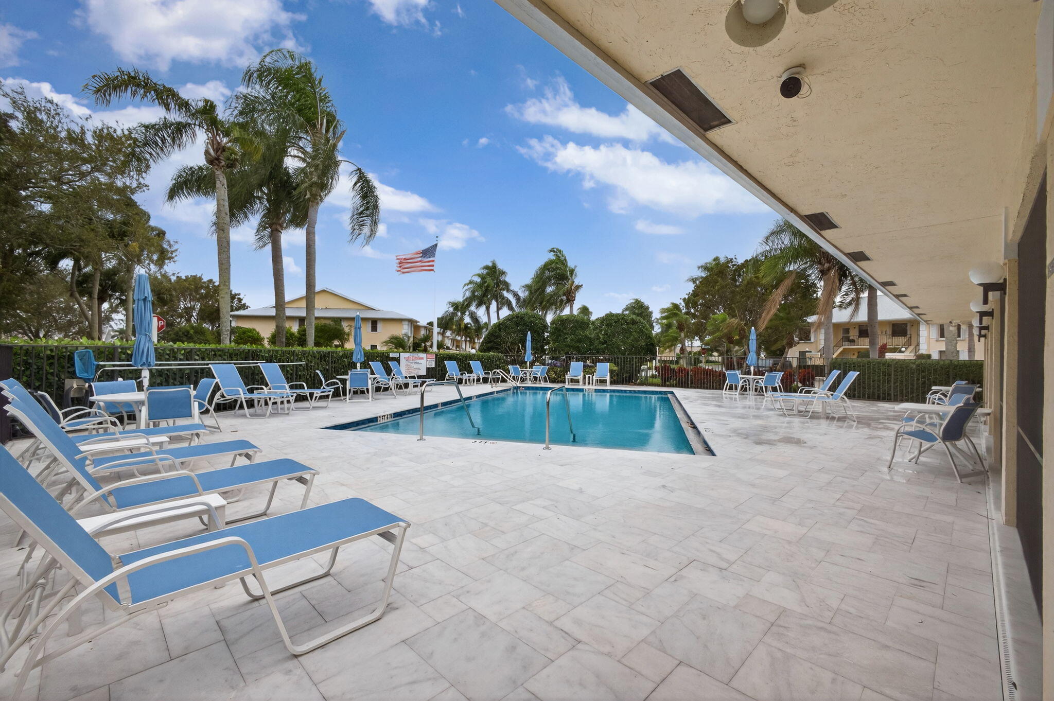 2041 Keystone Drive, Unit F Jupiter, FL 33458 - Photo 43 of 63 a view of swimming pool with outdoor seating and a patio