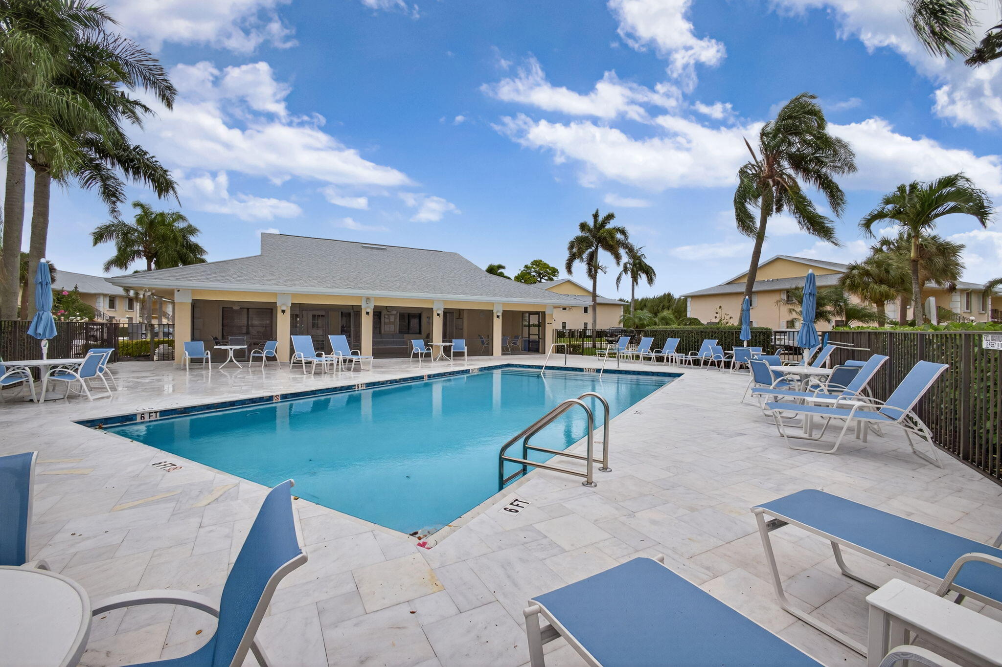 2041 Keystone Drive, Unit F Jupiter, FL 33458 - Photo 45 of 63 a view of a swimming pool with outdoor seating