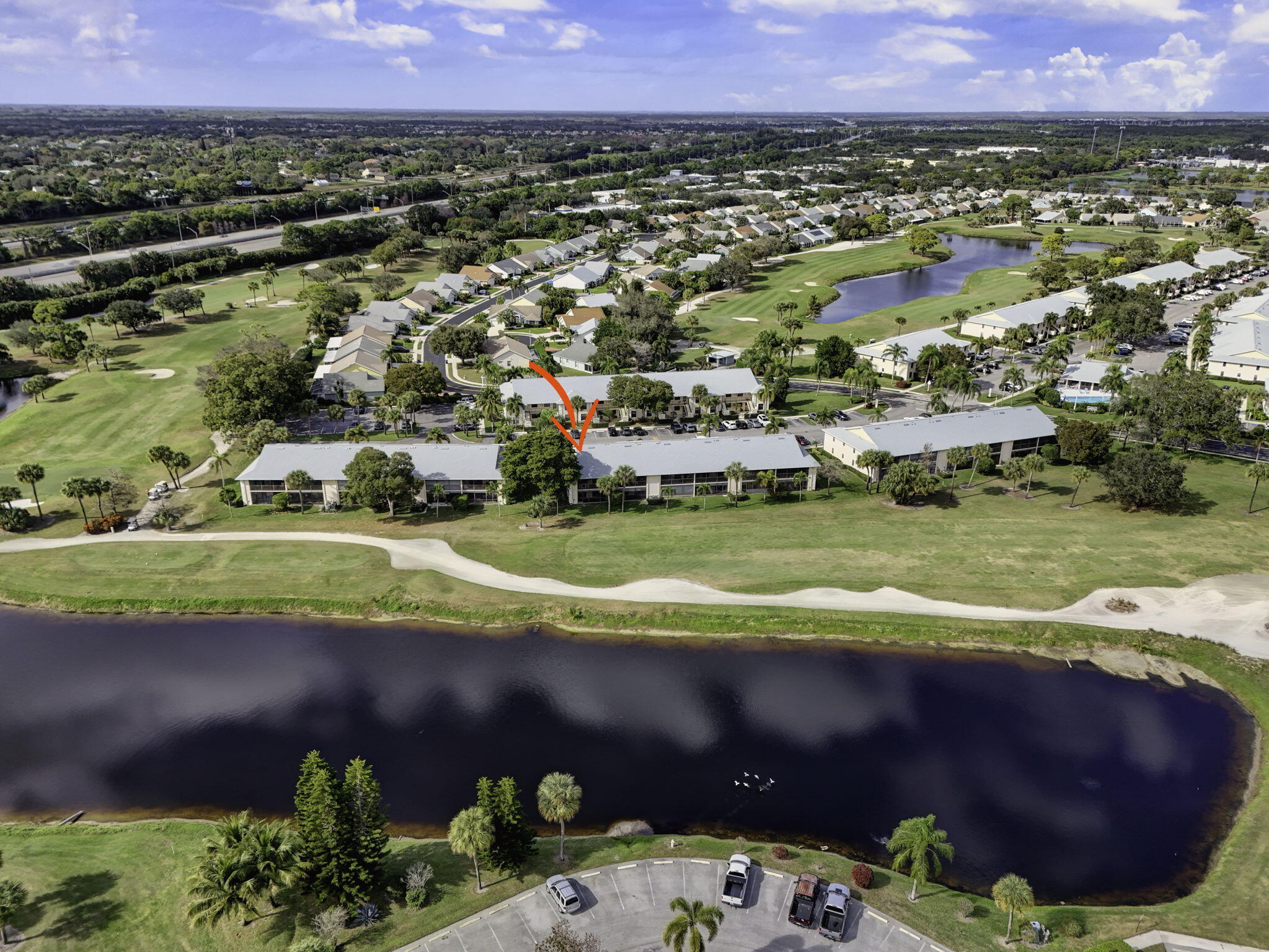 2041 Keystone Drive, Unit F Jupiter, FL 33458 - Photo 56 of 63 a view of a city with a lake