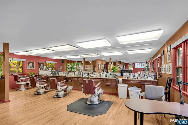 a room with lots of table and chairs