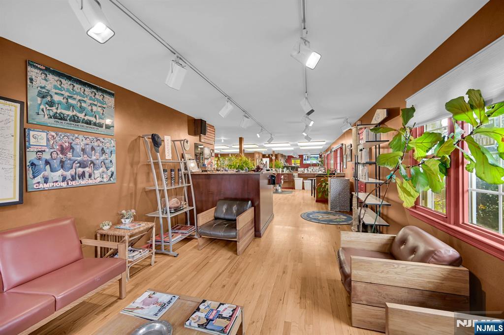857 Pompton Avenue Cedar Grove, NJ 07009 - Photo 6 of 16 a living room with furniture and a potted plant