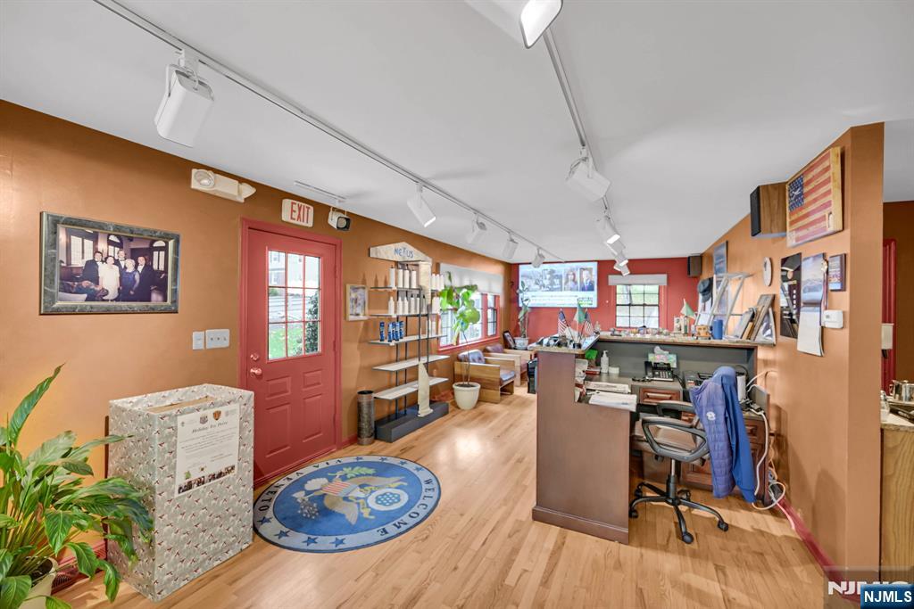 857 Pompton Avenue Cedar Grove, NJ 07009 - Photo 10 of 16 a view of a dining room with furniture window and wooden floor