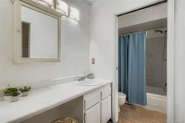 a bathroom with a sink a vanity and a mirror