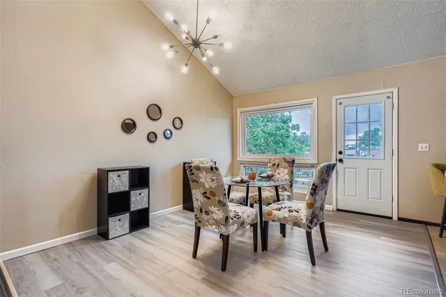 a dining room with furniture and window