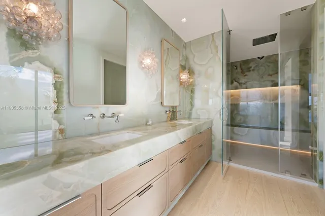 a bathroom with a double vanity sink and mirror