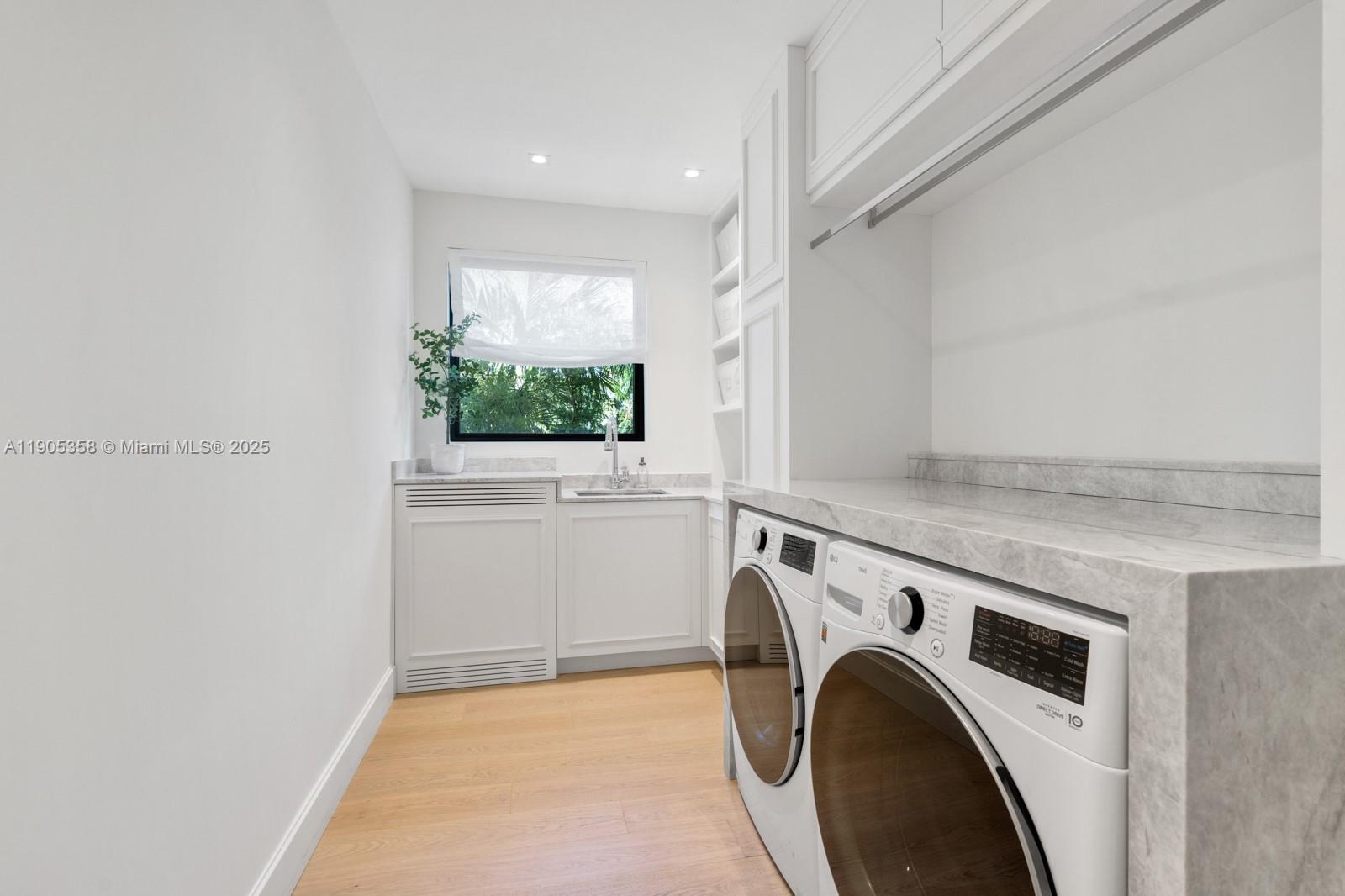 1165 North Biscayne Point Road Miami Beach, FL 33141 - Photo 25 of 31 a utility room with dryer and washer