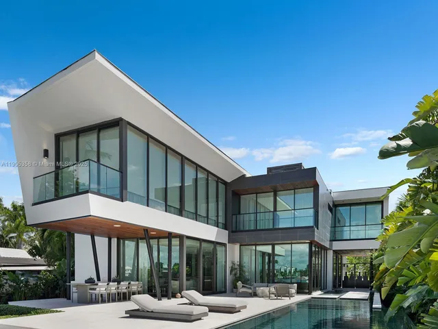 a view of house with swimming pool outdoor seating area and furniture