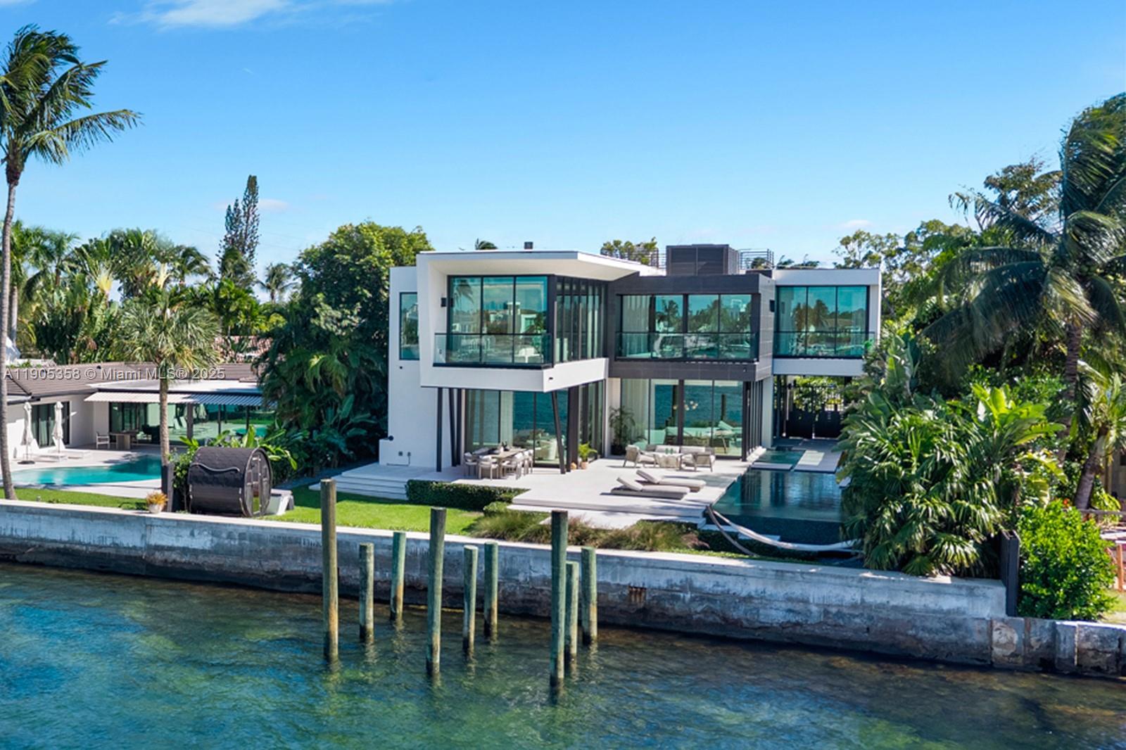 1165 North Biscayne Point Road Miami Beach, FL 33141 - Photo 31 of 31 a view of house with swimming pool outdoor seating area and furniture