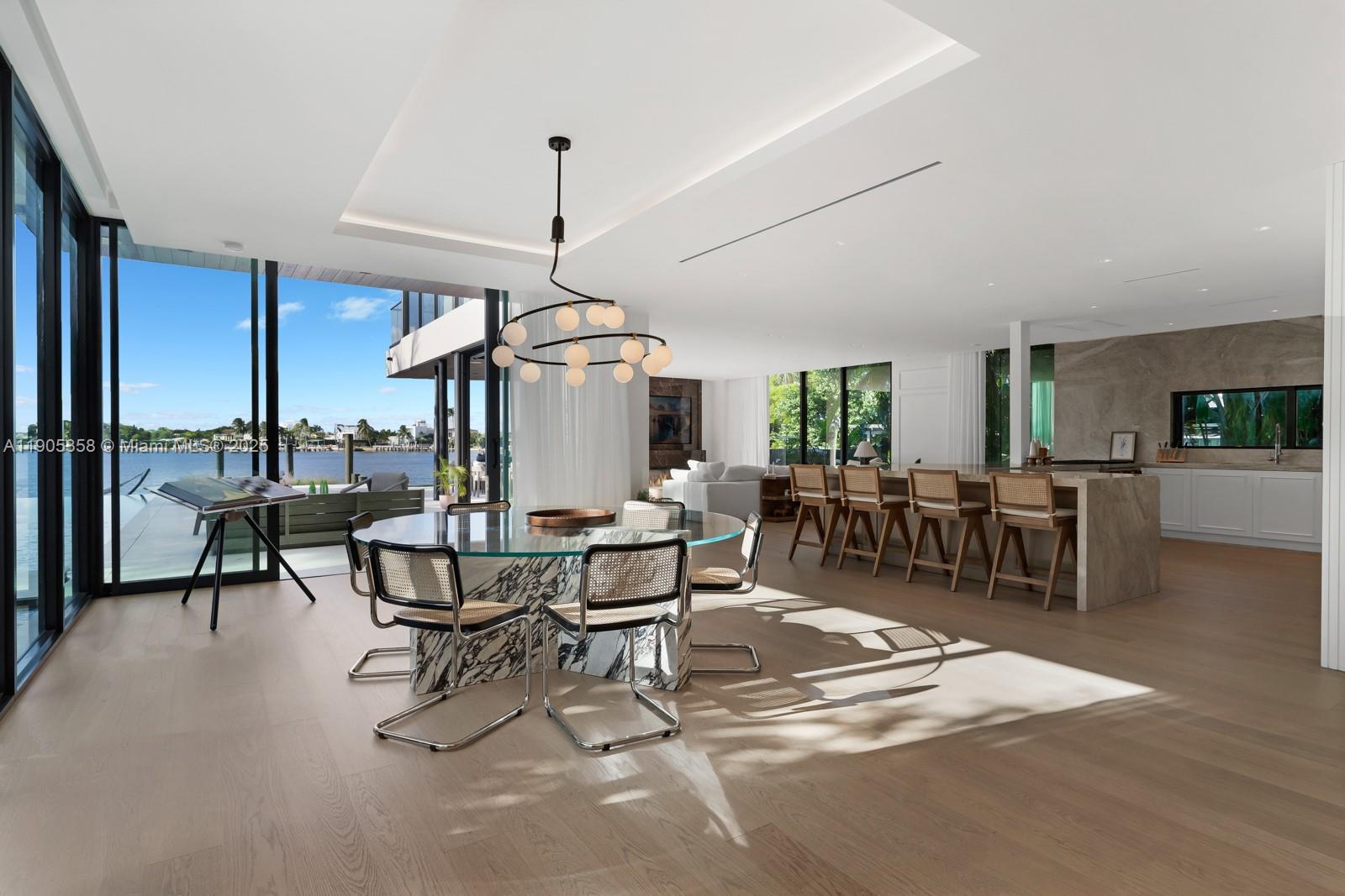 1165 North Biscayne Point Road Miami Beach, FL 33141 - Photo 4 of 31 a view of a dining room with furniture window and outside view