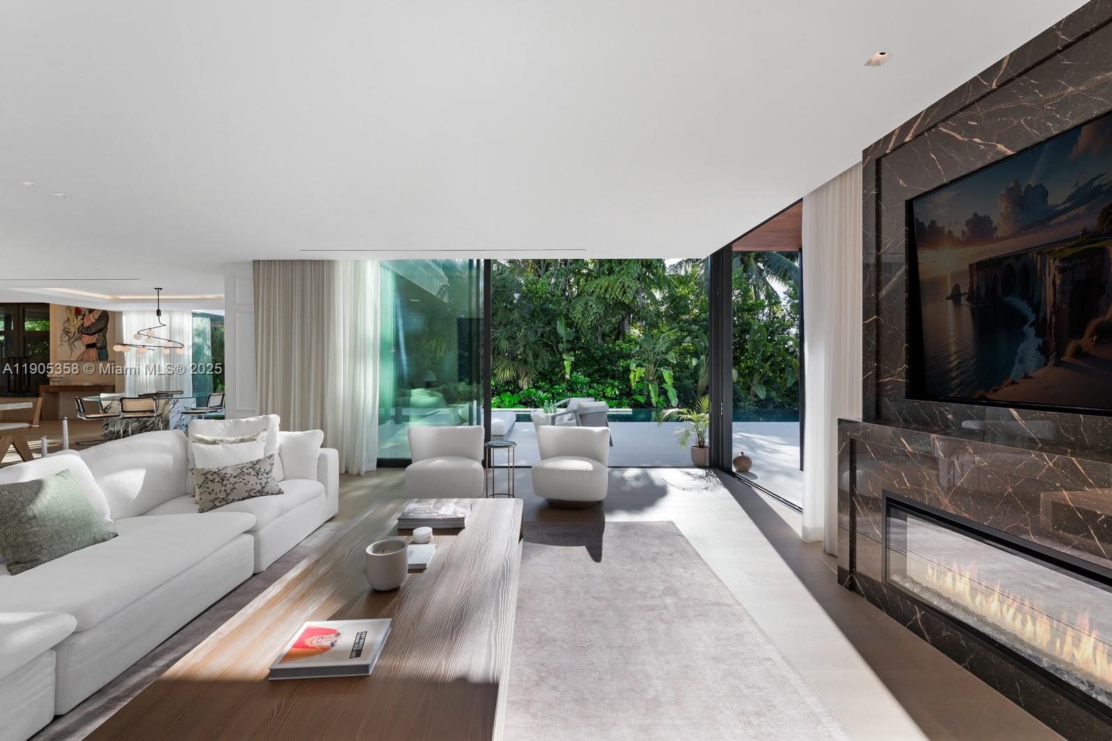 1165 North Biscayne Point Road Miami Beach, FL 33141 - Photo 6 of 31 a living room with furniture and a flat screen tv