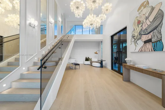 a view of a livingroom with furniture and stairs