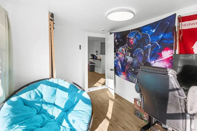 a view of a livingroom with furniture and window