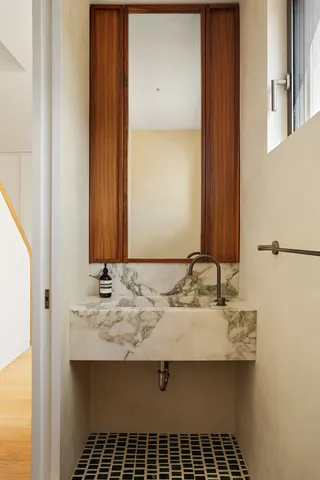 a bathroom with a sink and a mirror