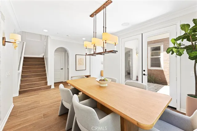 a view of a patio with couple of chairs and a fountain