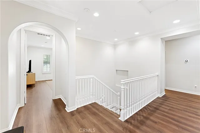 a spacious bathroom with a tub sink and mirror