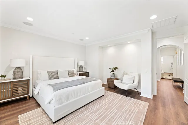a bathroom with a granite countertop tub sink and mirror