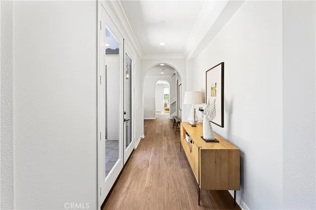 a dining room with furniture window and wooden floor