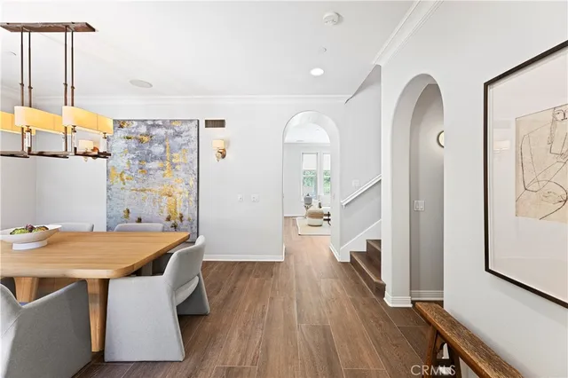 a view of a patio with table and chairs and potted plants