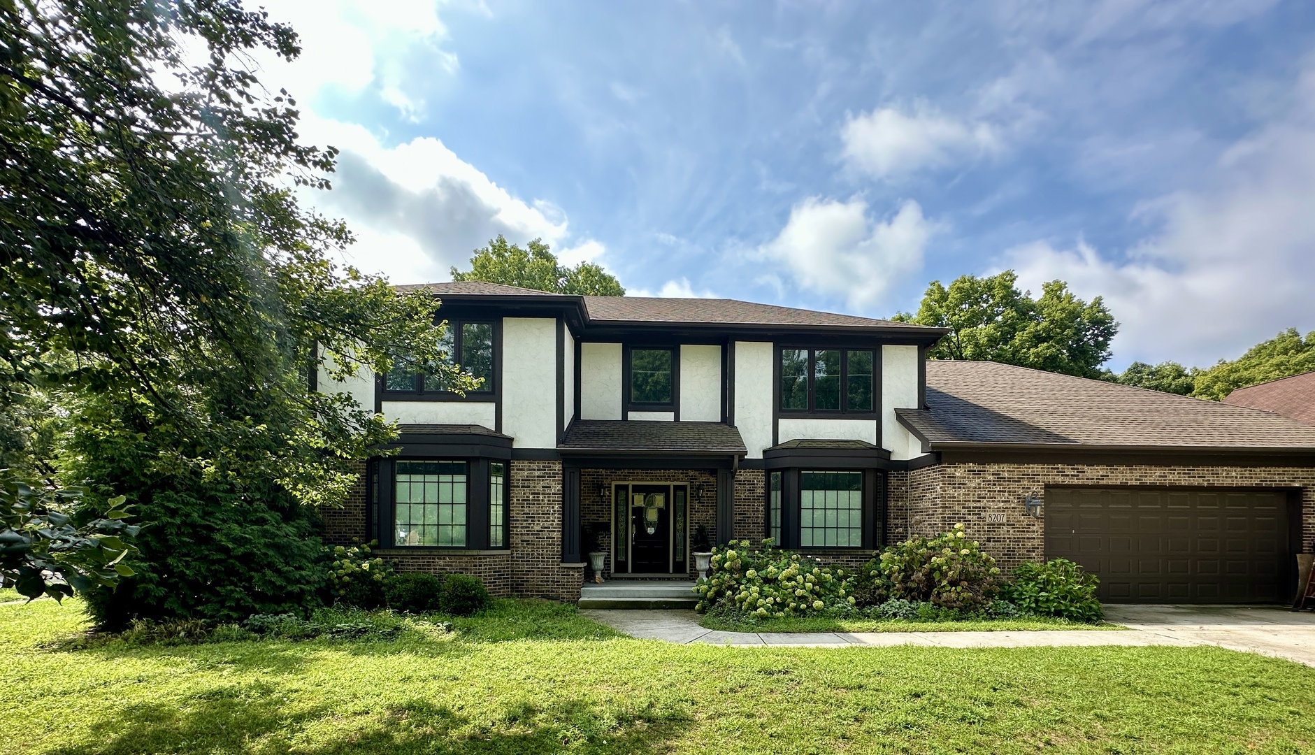 8207 West 30th Street North Riverside, IL 60546 - Photo 1 of 39 a front view of a house with garden
