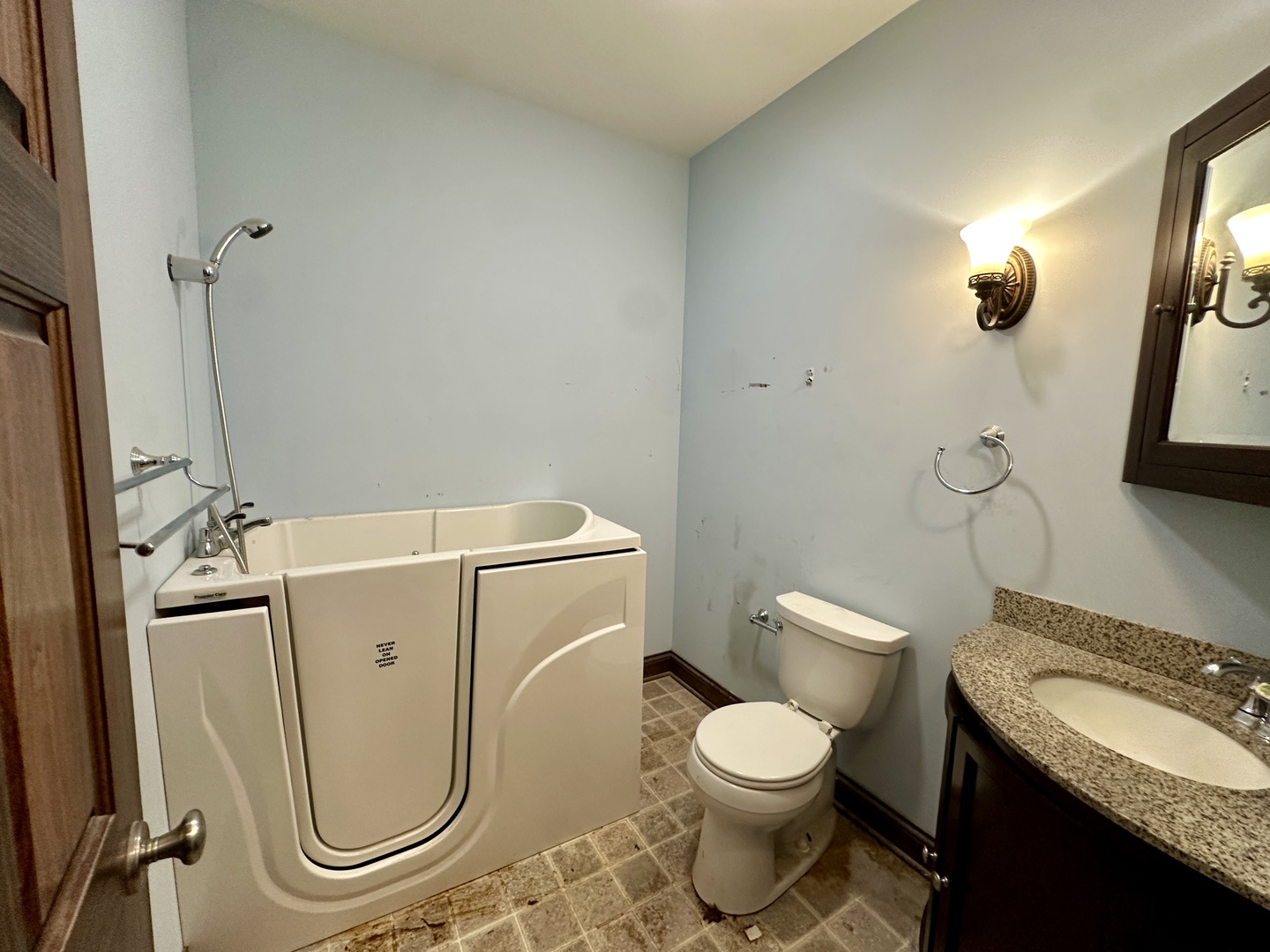 8207 West 30th Street North Riverside, IL 60546 - Photo 18 of 39 a bathroom with a granite countertop toilet sink and mirror