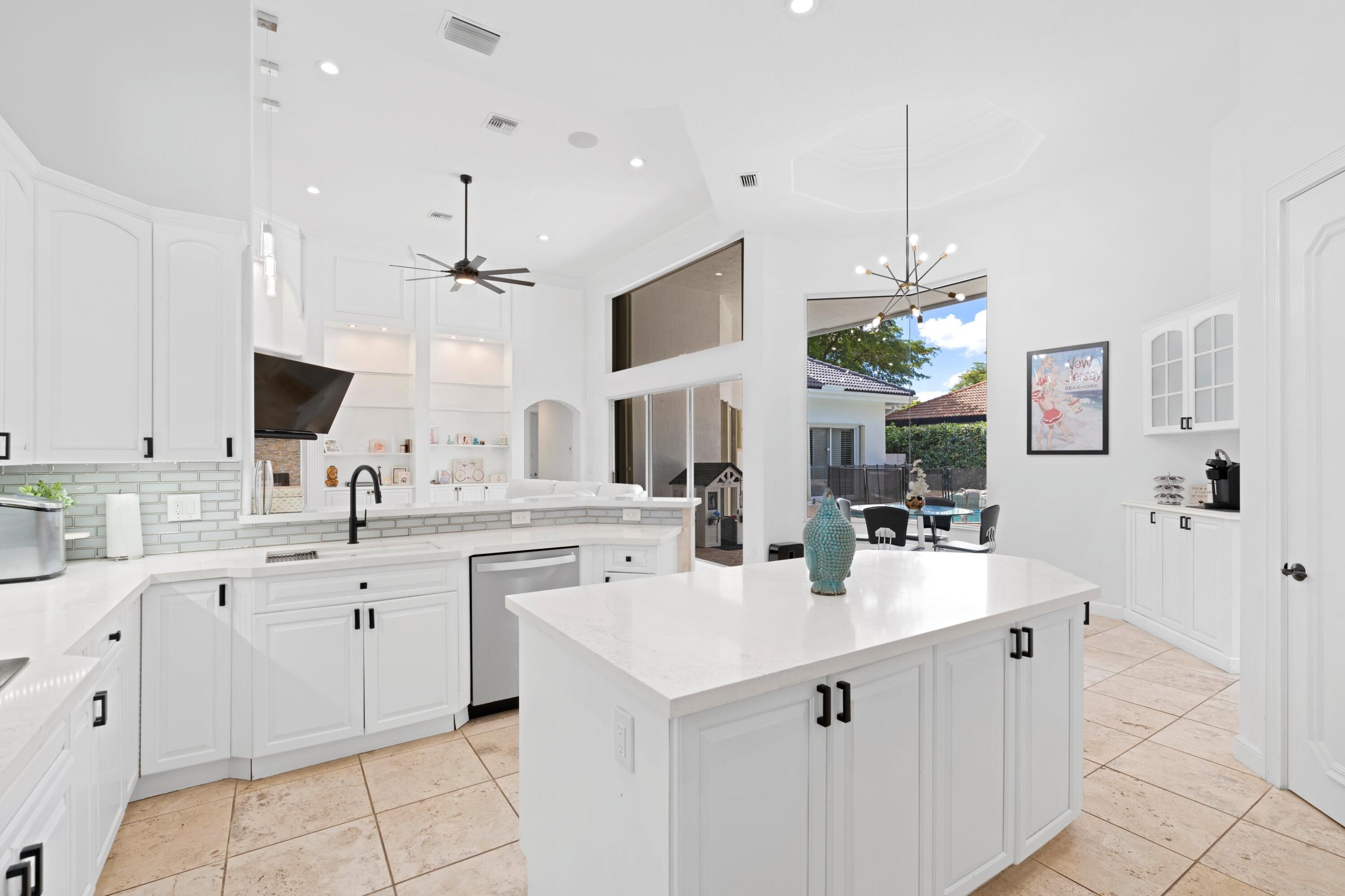 7796 Mandarin Drive Boca Raton, FL 33433 - Photo 9 of 36 Open Kitchen w/ quartz countertops