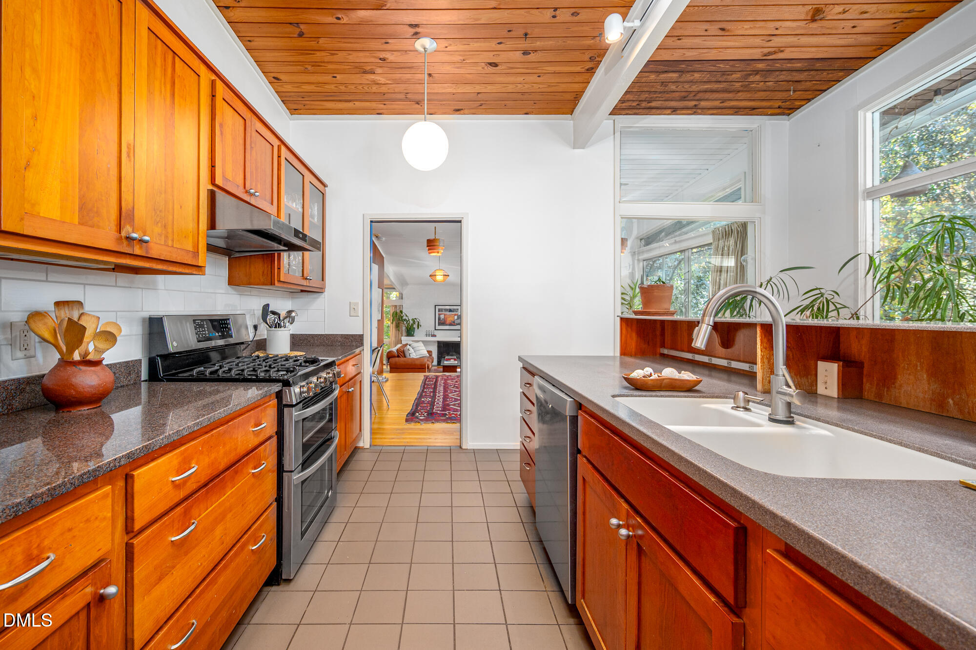 1030 Highland Woods Road Chapel Hill, NC 27517 - Photo 20 of 64 a kitchen with stainless steel appliances granite countertop a sink stove and cabinets