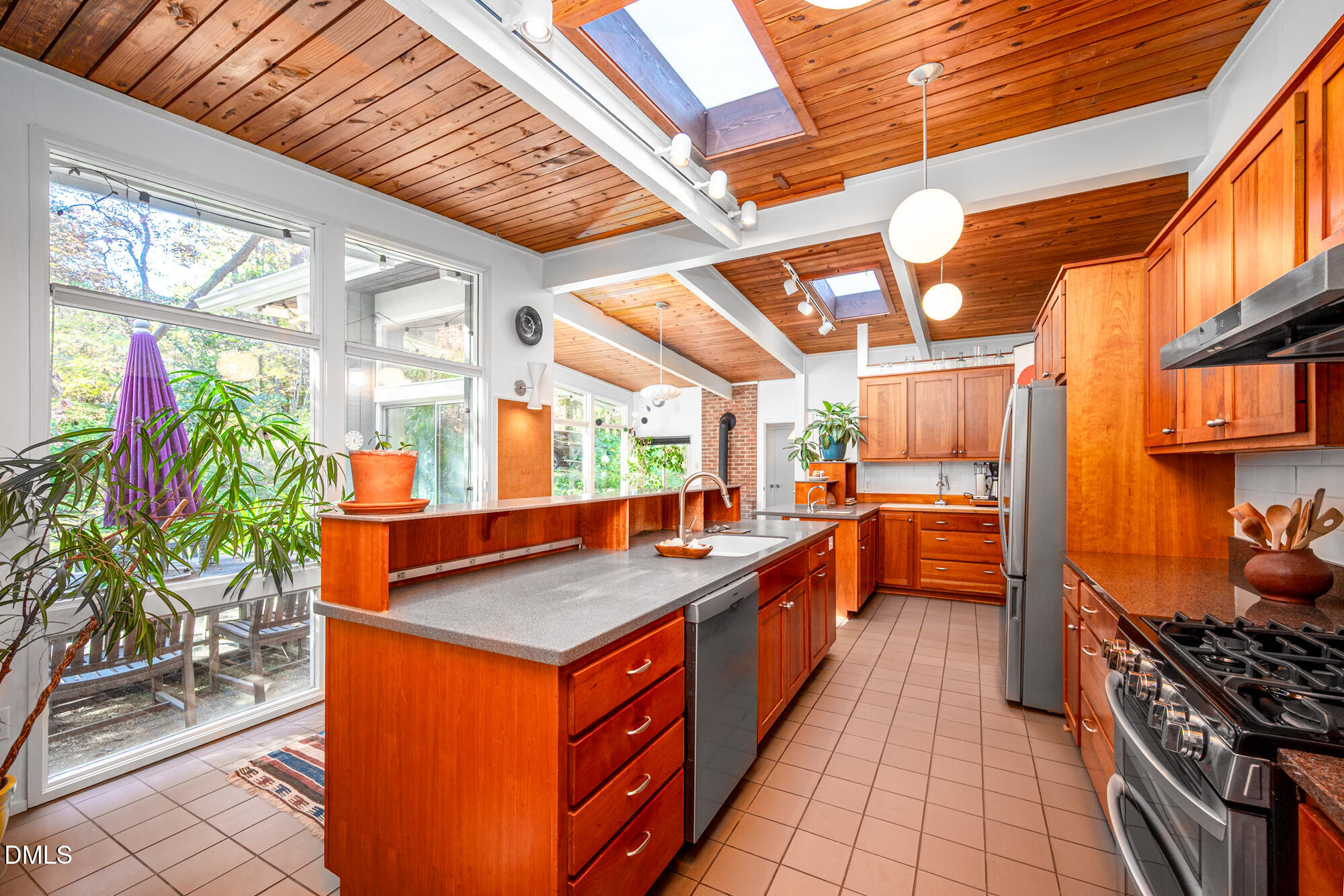 1030 Highland Woods Road Chapel Hill, NC 27517 - Photo 22 of 64 a kitchen with stainless steel appliances granite countertop a sink and a counter
