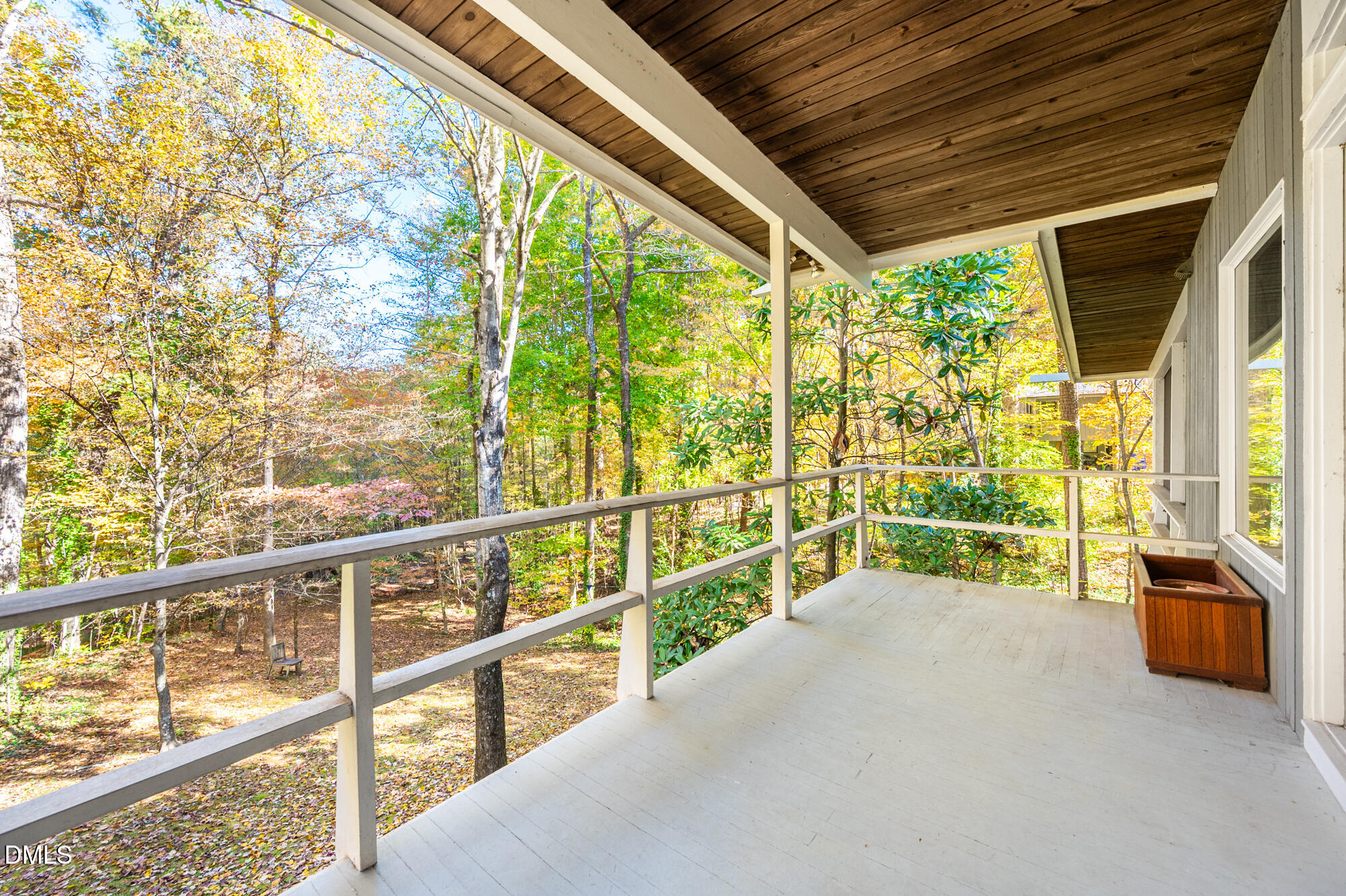 1030 Highland Woods Road Chapel Hill, NC 27517 - Photo 27 of 64 a view of a porch with furniture and floor to ceiling windows