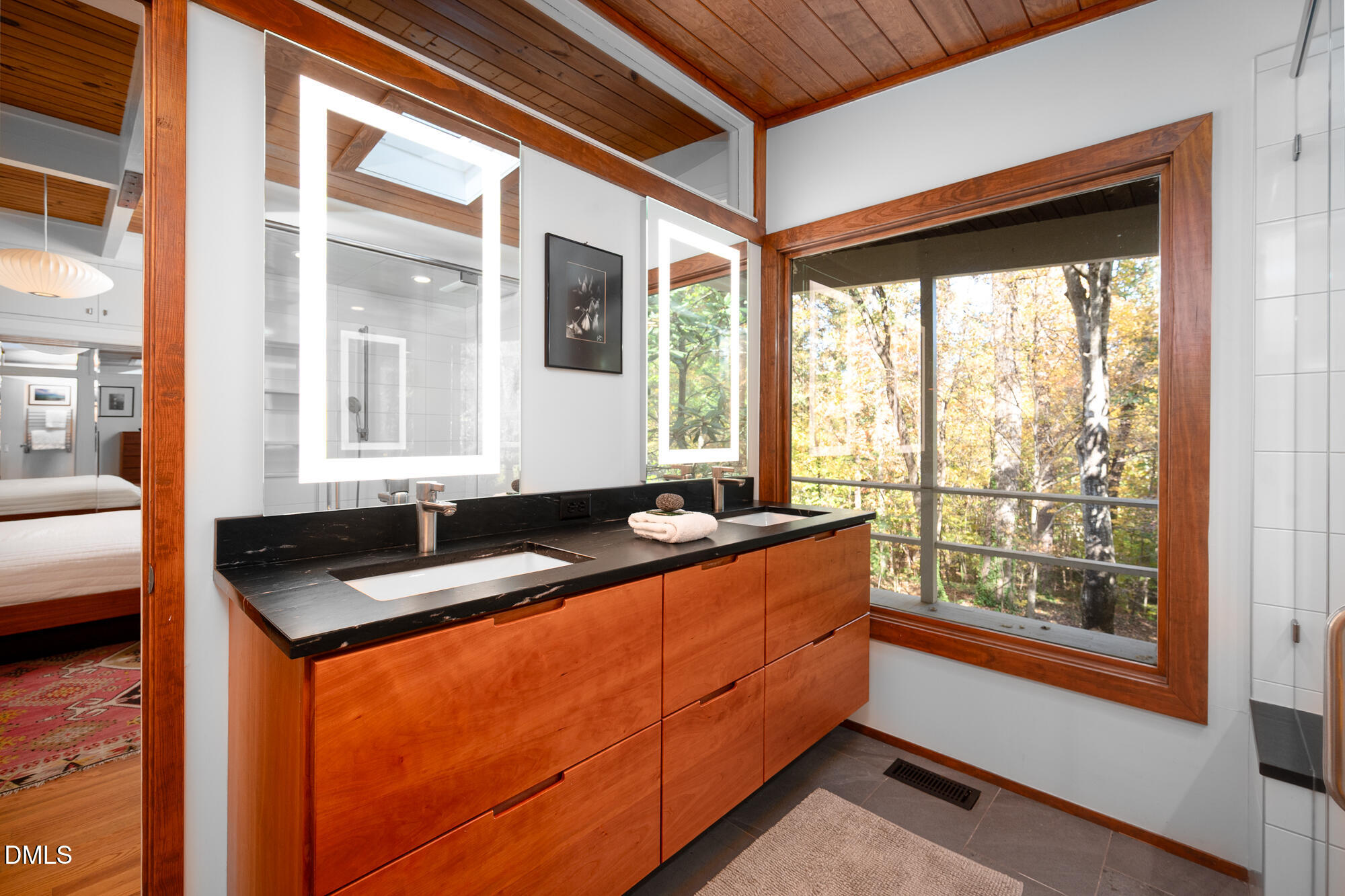1030 Highland Woods Road Chapel Hill, NC 27517 - Photo 30 of 64 a room with granite countertop a couch and a large window