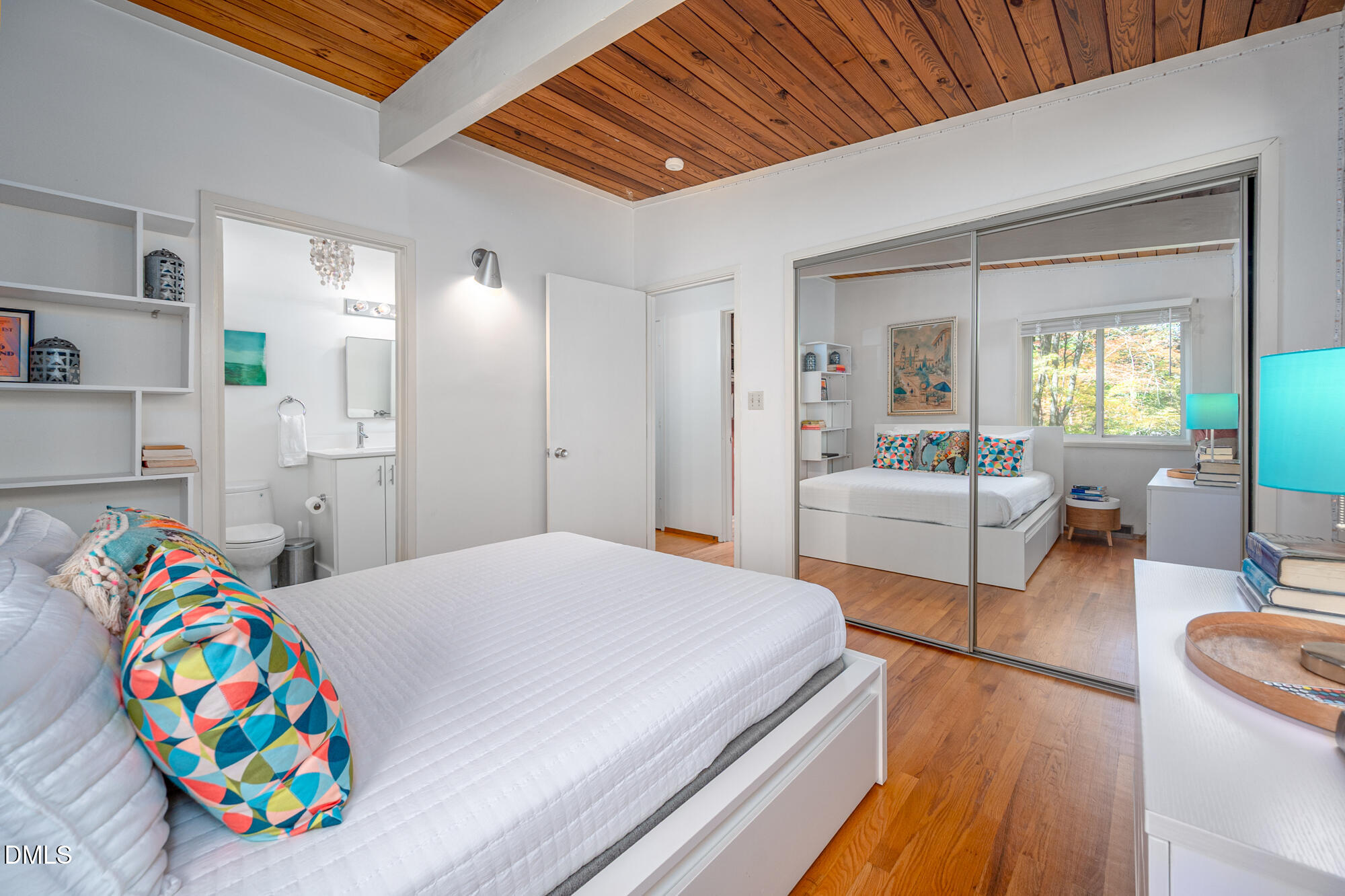1030 Highland Woods Road Chapel Hill, NC 27517 - Photo 36 of 64 a bedroom with furniture and a wooden floor