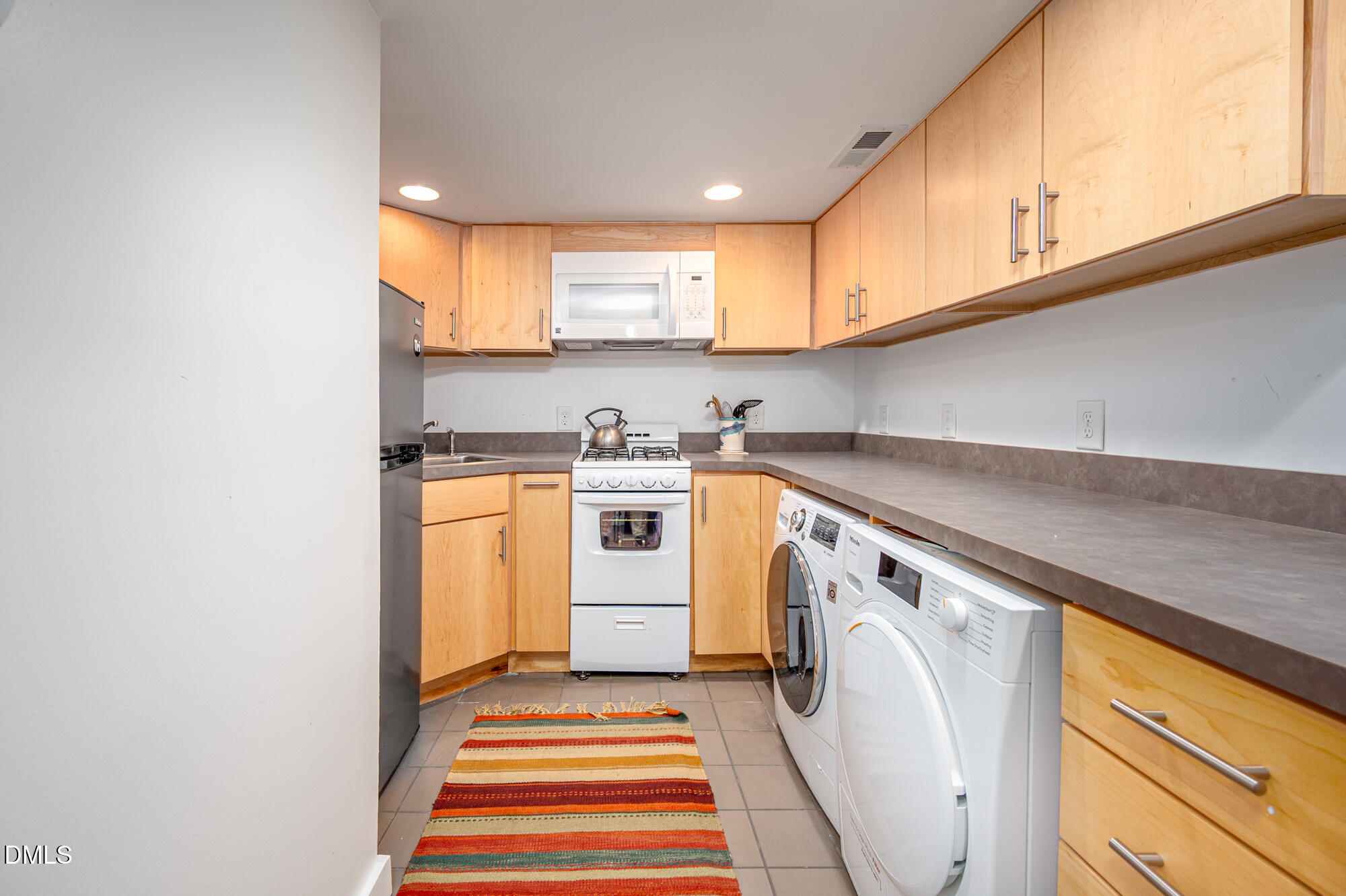 1030 Highland Woods Road Chapel Hill, NC 27517 - Photo 43 of 64 a utility room with sink dryer and washer