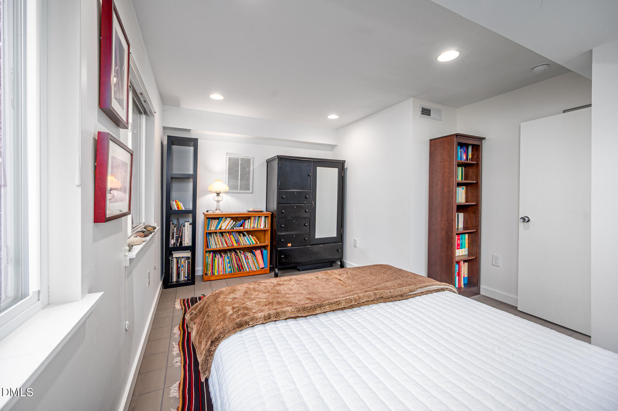 1030 Highland Woods Road Chapel Hill, NC 27517 - Photo 48 of 64 a bedroom with a large bed and a closet