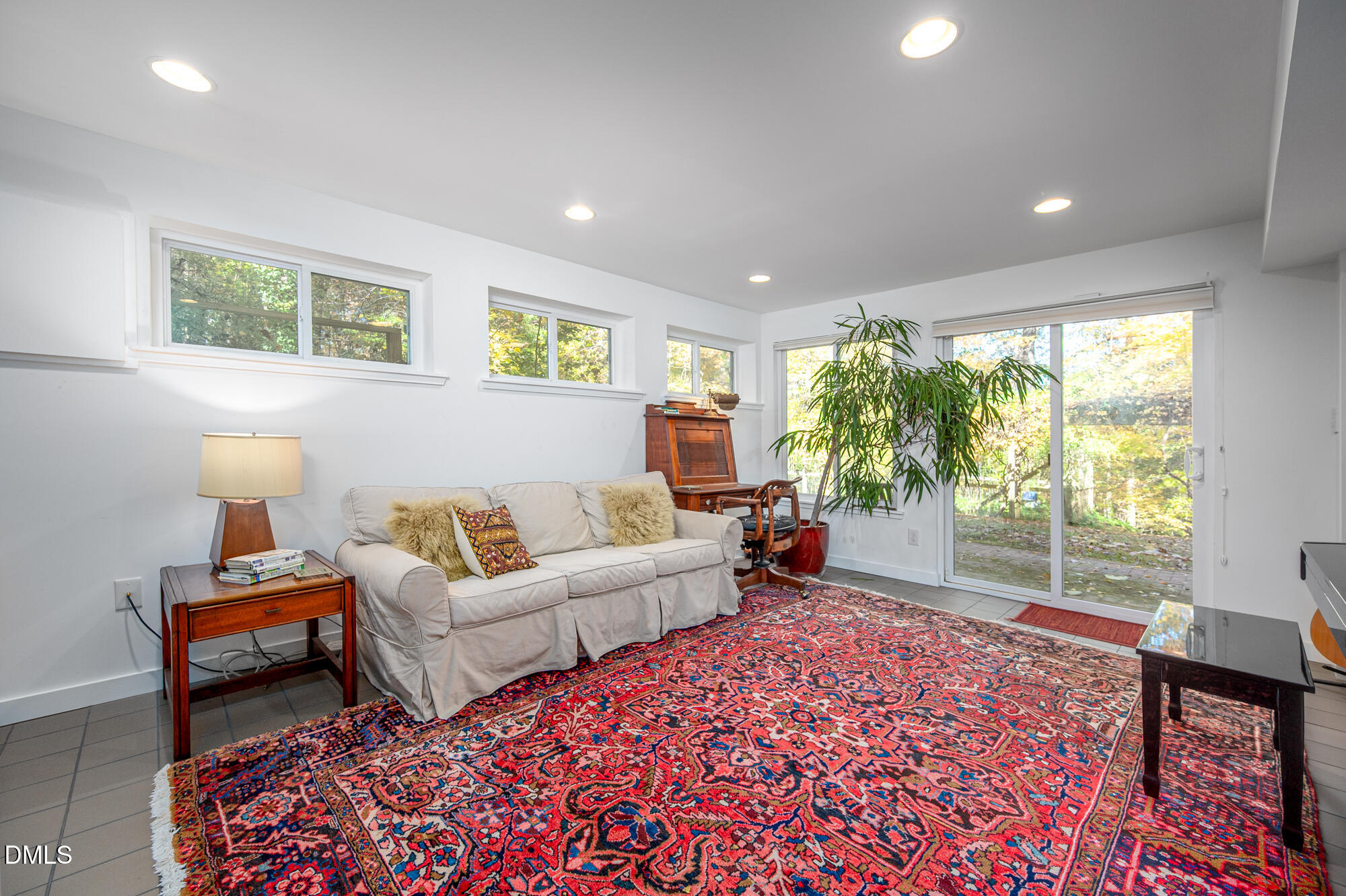 1030 Highland Woods Road Chapel Hill, NC 27517 - Photo 49 of 64 a living room with furniture and a large window