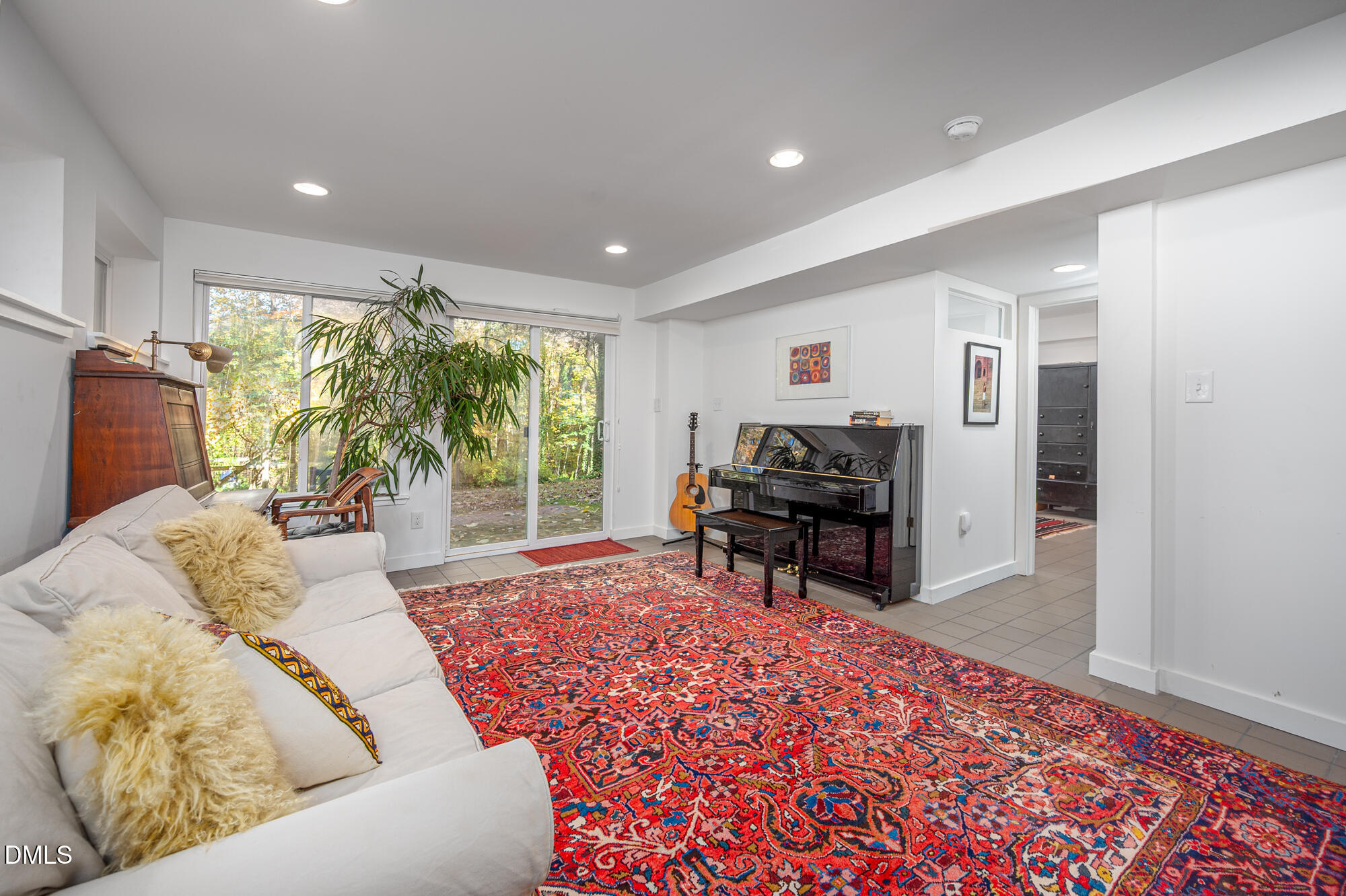 1030 Highland Woods Road Chapel Hill, NC 27517 - Photo 50 of 64 a living room with furniture and a flat screen tv