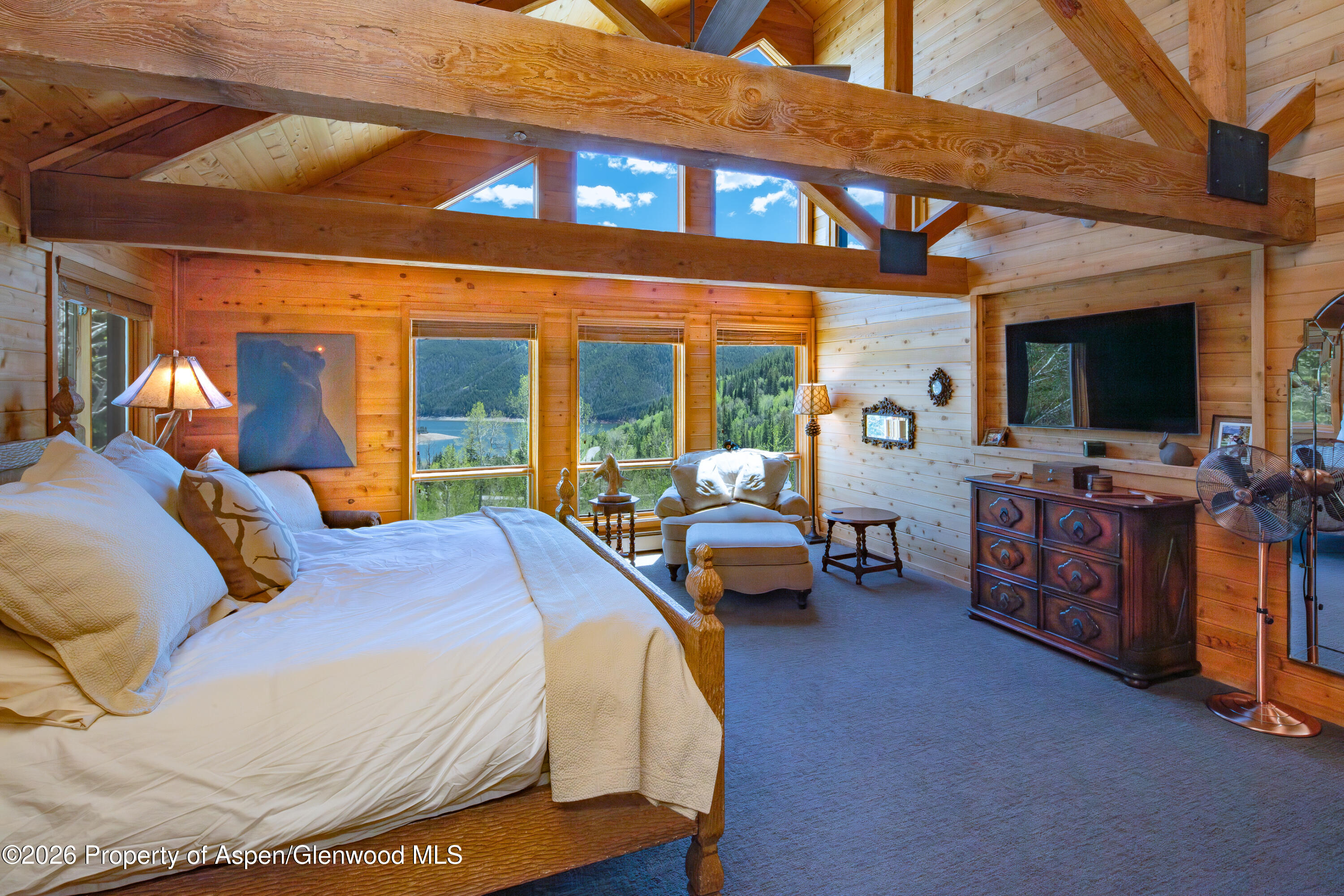 294 Ruedi Creek Road Basalt, CO 81621 - Photo 21 of 27 a bedroom with a bed and large windows