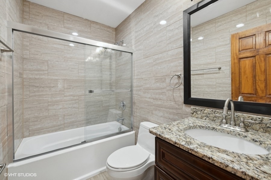 369 Blackhawk Road Riverside, IL 60546 - Photo 14 of 31 a bathroom with a granite countertop sink toilet and shower