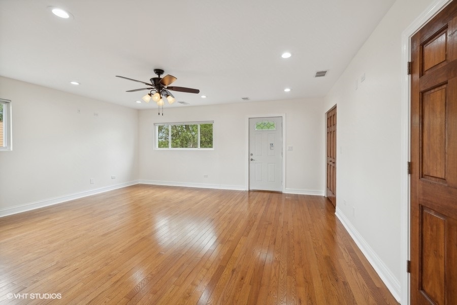 369 Blackhawk Road Riverside, IL 60546 - Photo 17 of 31 wooden floor in an empty room with a window