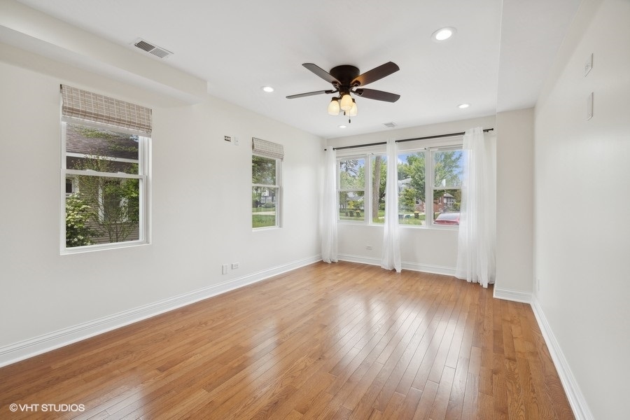 369 Blackhawk Road Riverside, IL 60546 - Photo 18 of 31 a view of empty room with wooden floor and fan