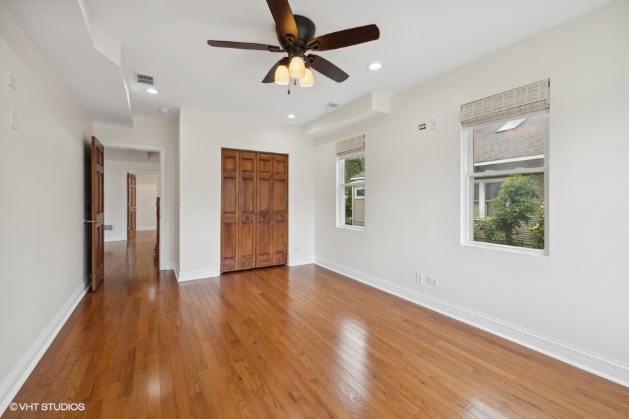 369 Blackhawk Road Riverside, IL 60546 - Photo 19 of 31 a view of an empty room with window and wooden floor