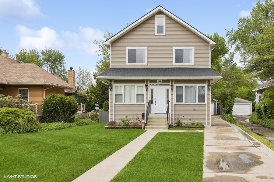 369 Blackhawk Road Riverside, IL 60546 - Photo 2 of 31 a front view of a house with a yard