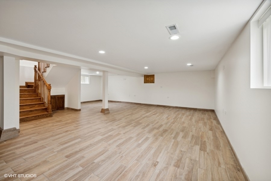 369 Blackhawk Road Riverside, IL 60546 - Photo 21 of 31 a view of a livingroom with wooden floor and stairs