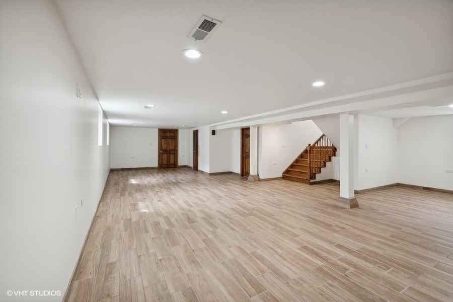 369 Blackhawk Road Riverside, IL 60546 - Photo 22 of 31 a view of an empty room with wooden floor